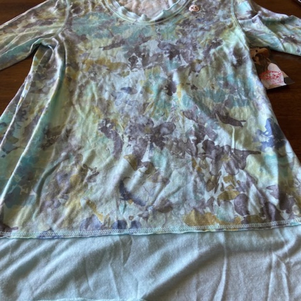 Very pretty fancy blue tee with flounce brand new Size XS
